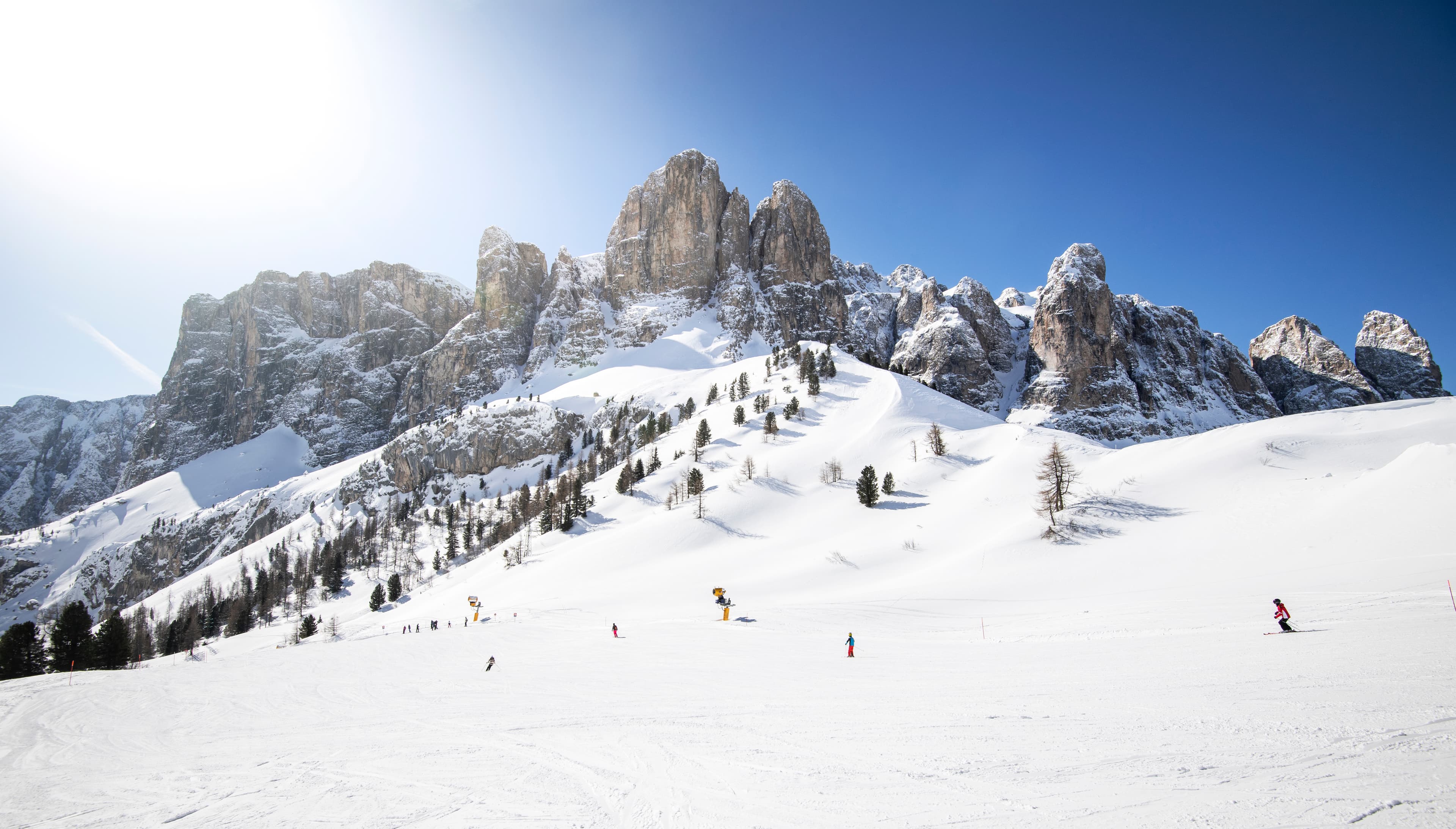 Skiiers enjoying dolomites ski slope